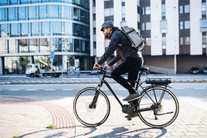 Biker crossing street