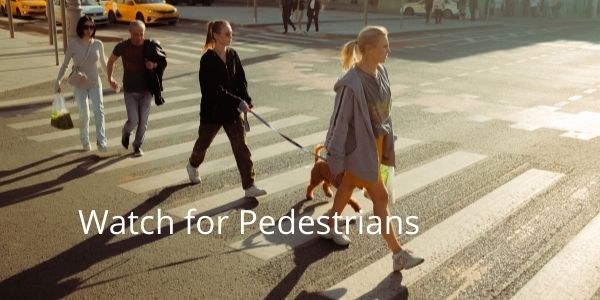 Watch out for pedestrians crossing the street in Toronto Canada.